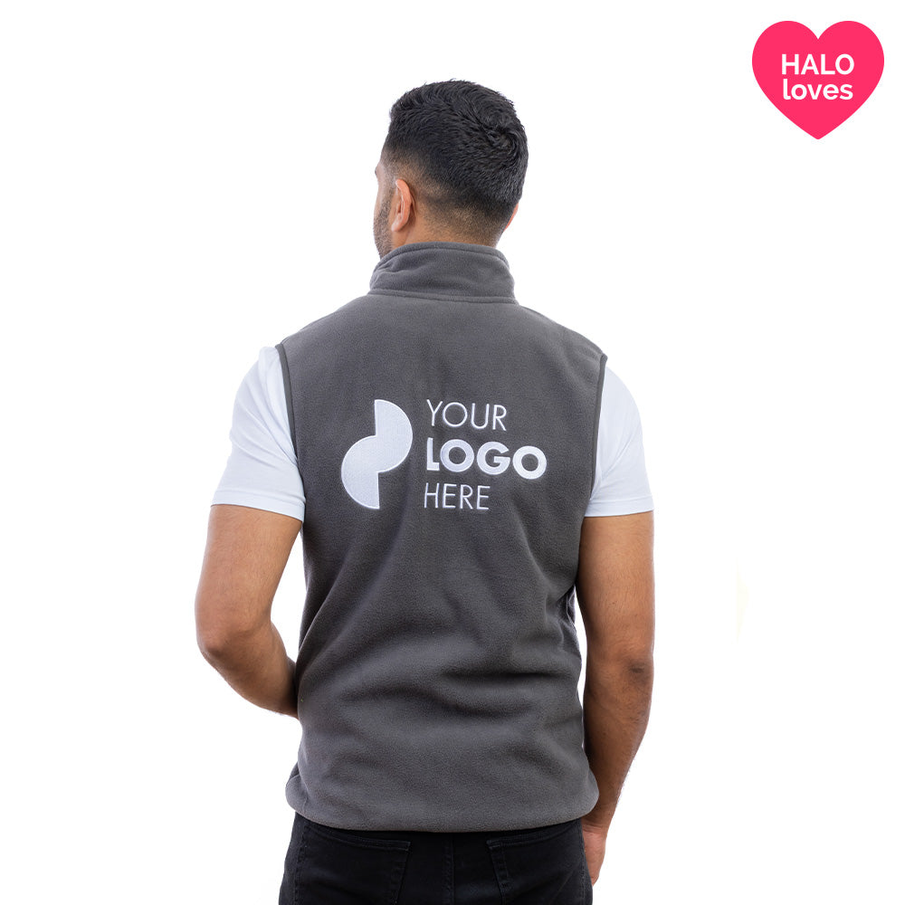 A man in a charcoal Halo Fleece Gilet from behind.