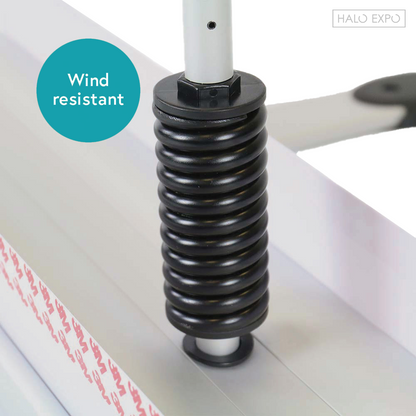 A close up of a strong spring labeled as wind resistant.