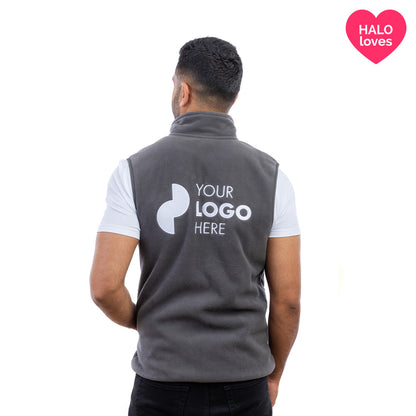 A man in a charcoal Halo Fleece Gilet from behind.
