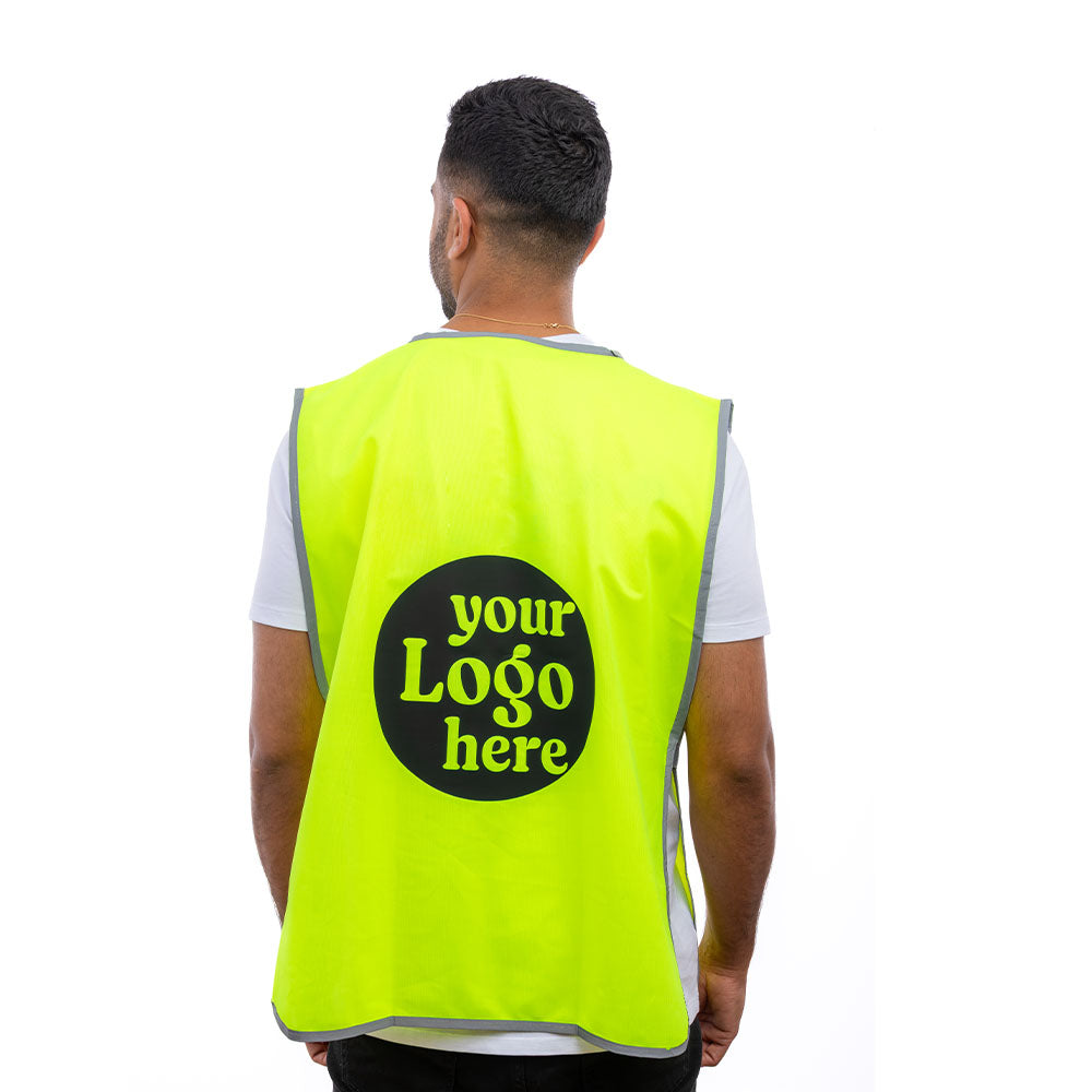A man in a Hi-Vis Yellow Halo Tabard from behind.